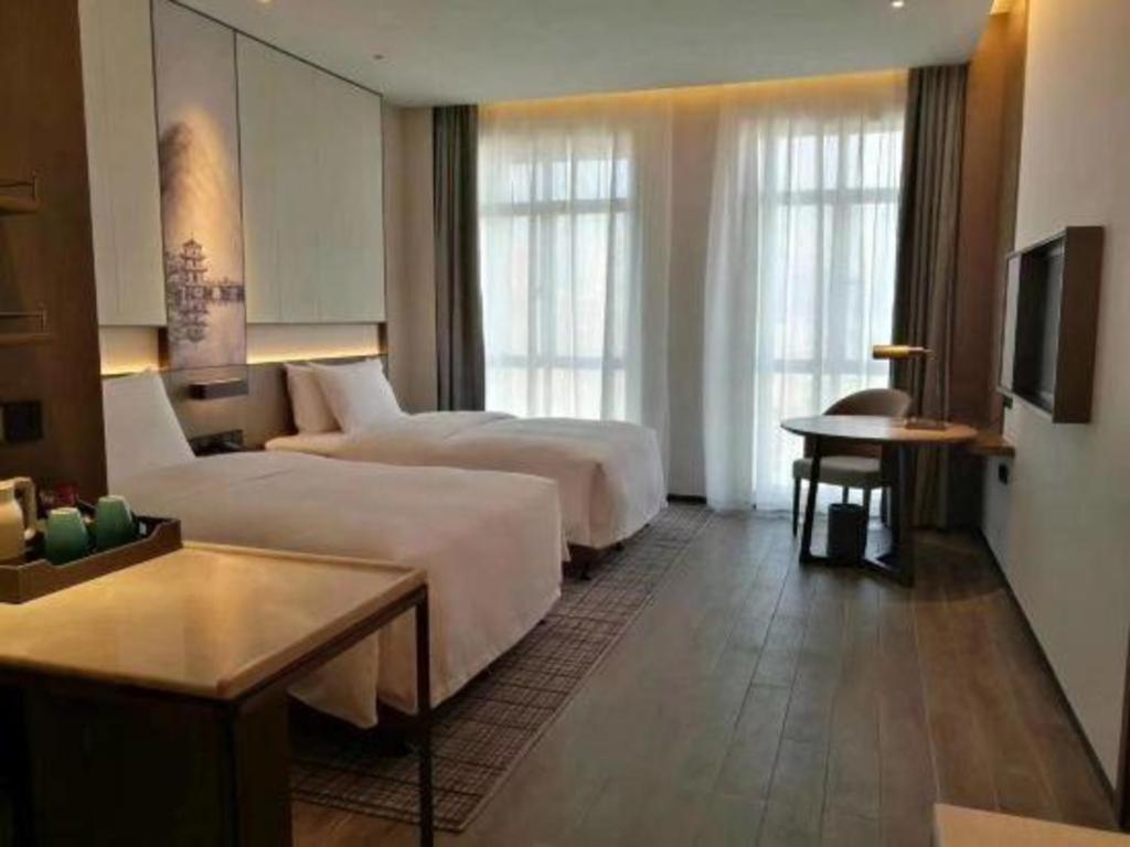 Wanda Jin Baise Hotel Extérieur photo